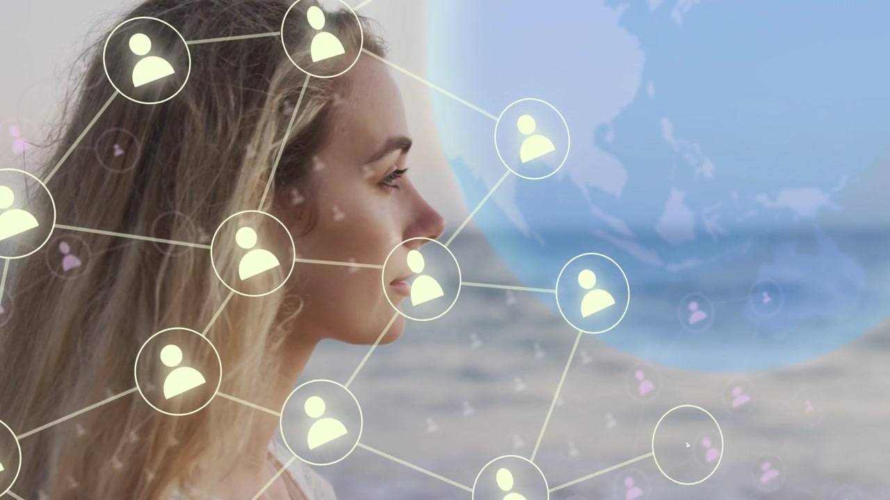 Woman standing shore, node appearing near ear and spanning across hair to globe showing tech ties