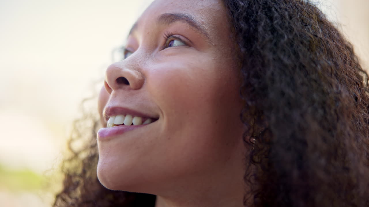 Face, thinking and smile with a woman outdoor