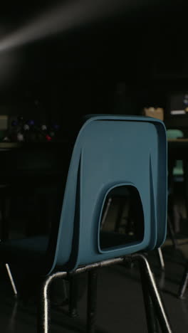 empty classroom with blue chairs