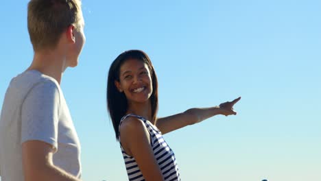 Happy-couple-interacting-with-each-other-near-railings-4k