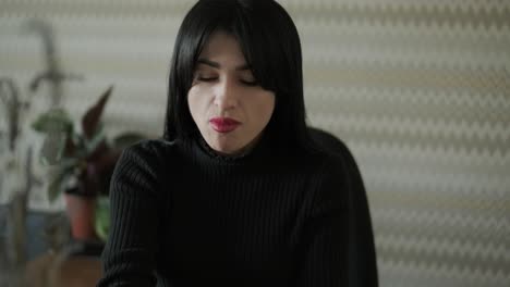 professional woman in a modern office environment, focused on work, dressed elegantly in business attire, surrounded by office equipment and a sleek interior