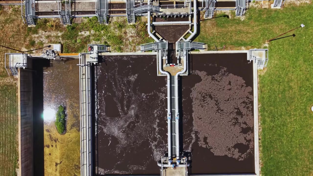 Aerial perspective of treatment plant showcasing infrastructure efficiency. Camera captures comprehensive layout and operation of wastewater treatment installation