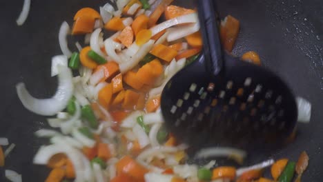 stir fry fresh vegetables in wok, bright and steamy