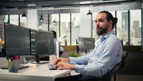 smiling day trader at work buying and selling stock