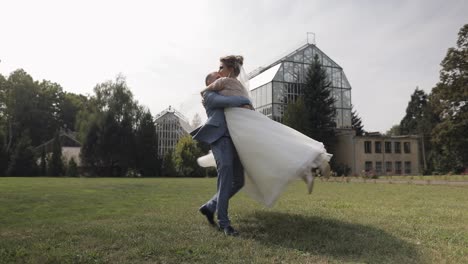 a happy bride and groom kiss on their wedding day.