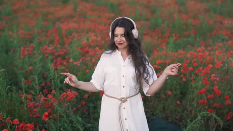 woman dancing in a poppy field