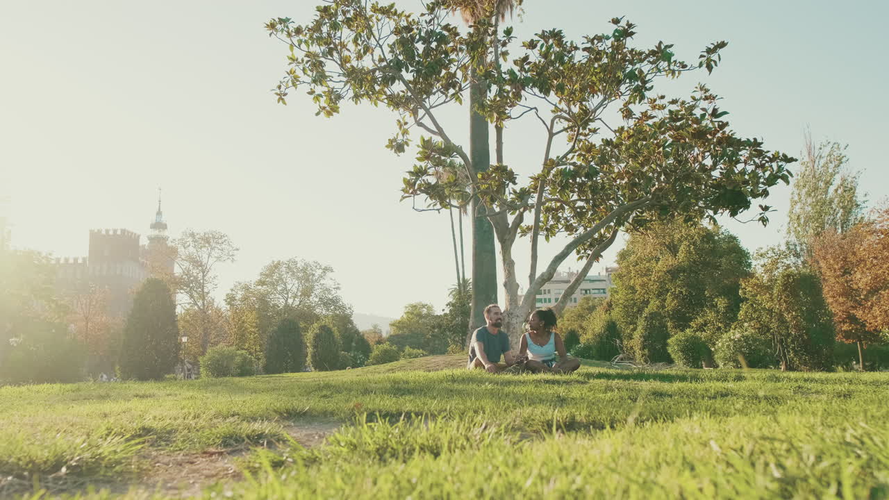 Couple Meditating in a Park
