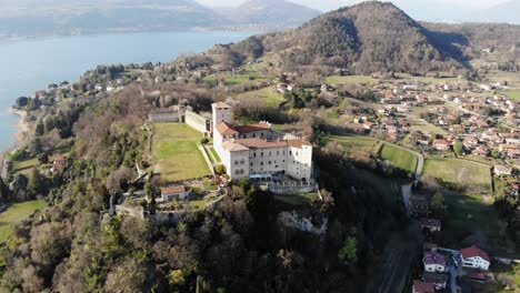 a circle flight of a mavic air drone around the rocca di angera in a perfect spring sunny day