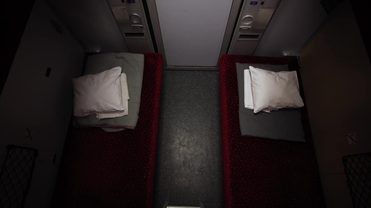 Beds on a night train, tilt down overhead establisher
