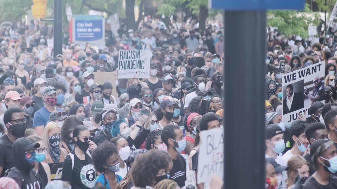 Handheld shot of the mass of protesters at the Black Lives Matter rally in Ottawa