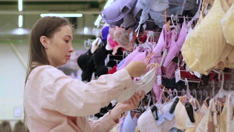 woman browsing lingerie in a store