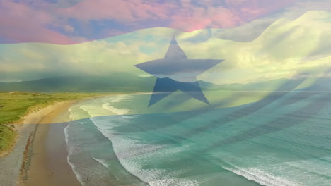 digital composition of ghana flag waving against aerial view of waves in the sea