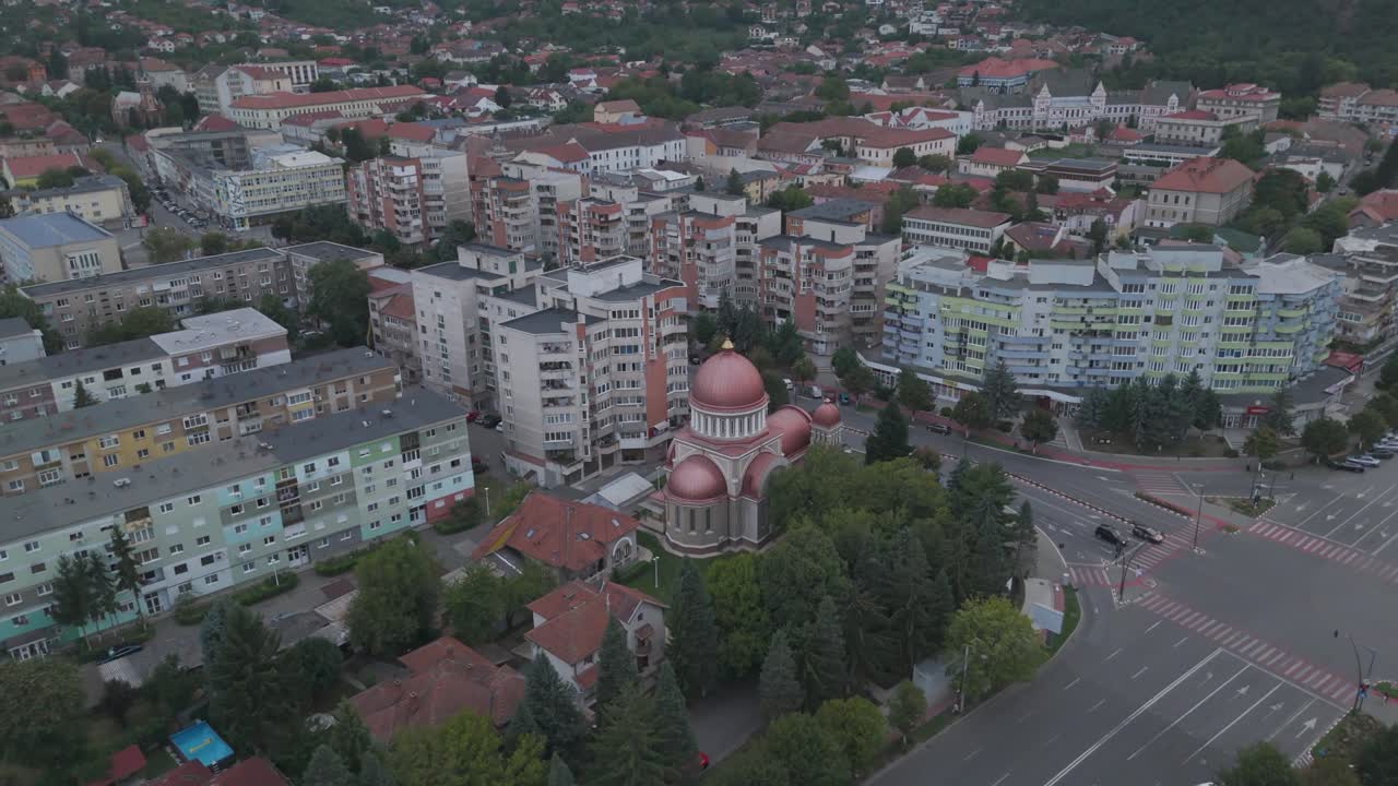 Scenic twilight view highlighting the church’s domes and architectural details against the urban skyline