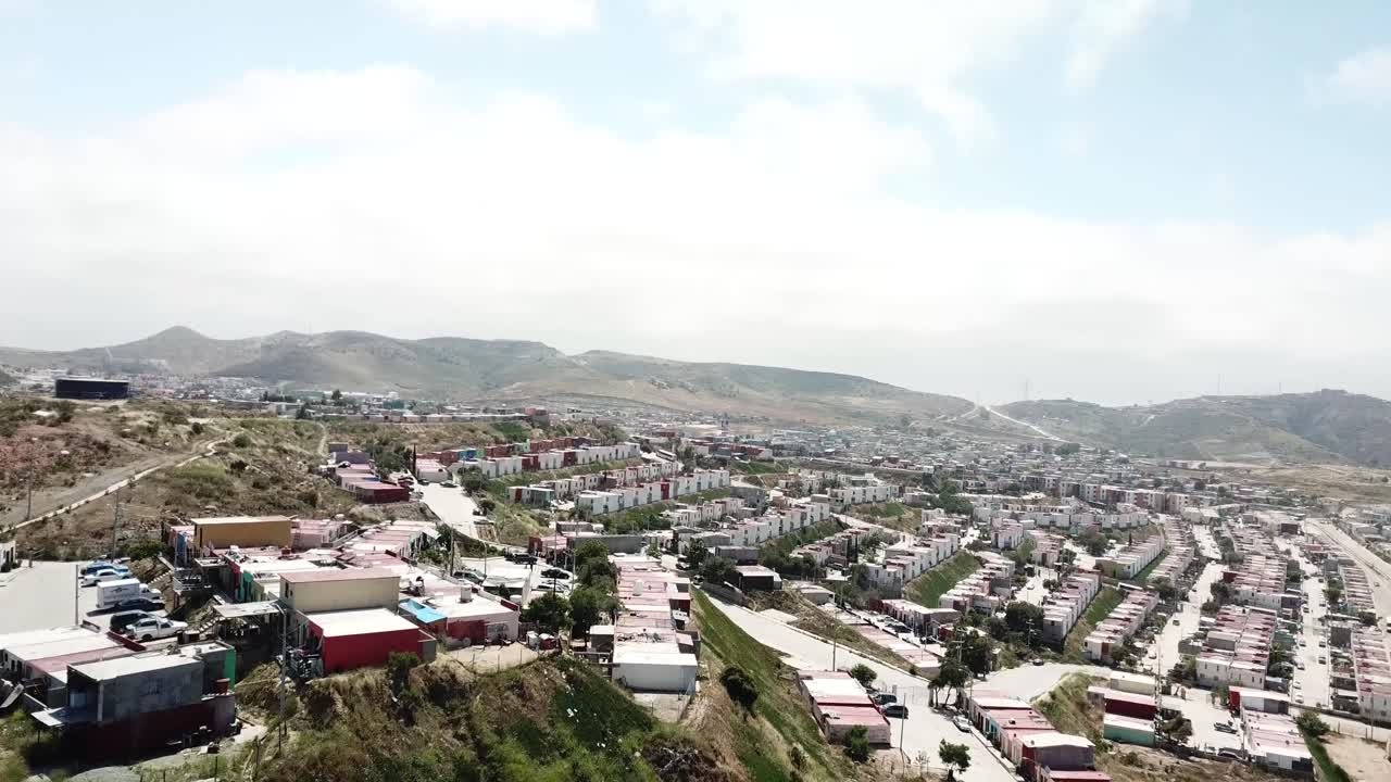 Aerial View of a Residential Area in a Hilly Landscape