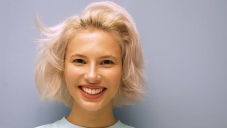 woman smiling and kissing hand
