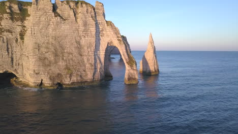 aerial footage of the beautiful french coastline along the village of étretat