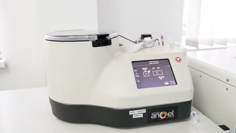 modern medical centrifuge machine for plasma extraction from blood. preparation of prp concentrate.