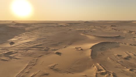 sandy expanse under a desert sky