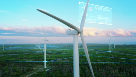 scenic aerial drone footage of environmental wind turbines in a forest near the sea. green renewable energy park with vfx augmented reality holograms shows internet of things online connectivity.