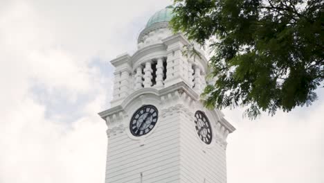 victoria theatre and concert hall clocktower in singapore against cloudy sky - low angle shot