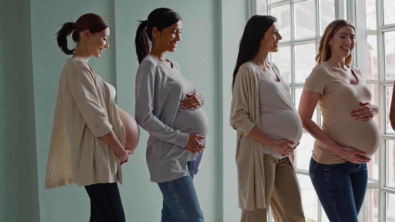 Four Pregnant Women Sharing a Moment of Joy