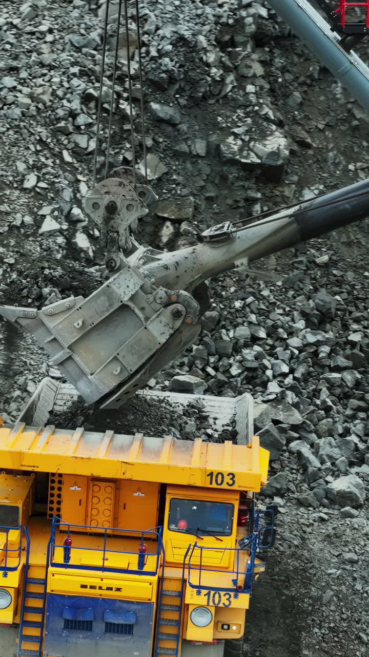 Heavy Machinery at Work: Excavator and Dump Truck in Open-Pit Mining