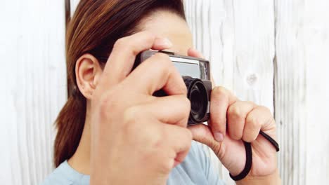 Photographer-taking-photo-with-vintage-camera