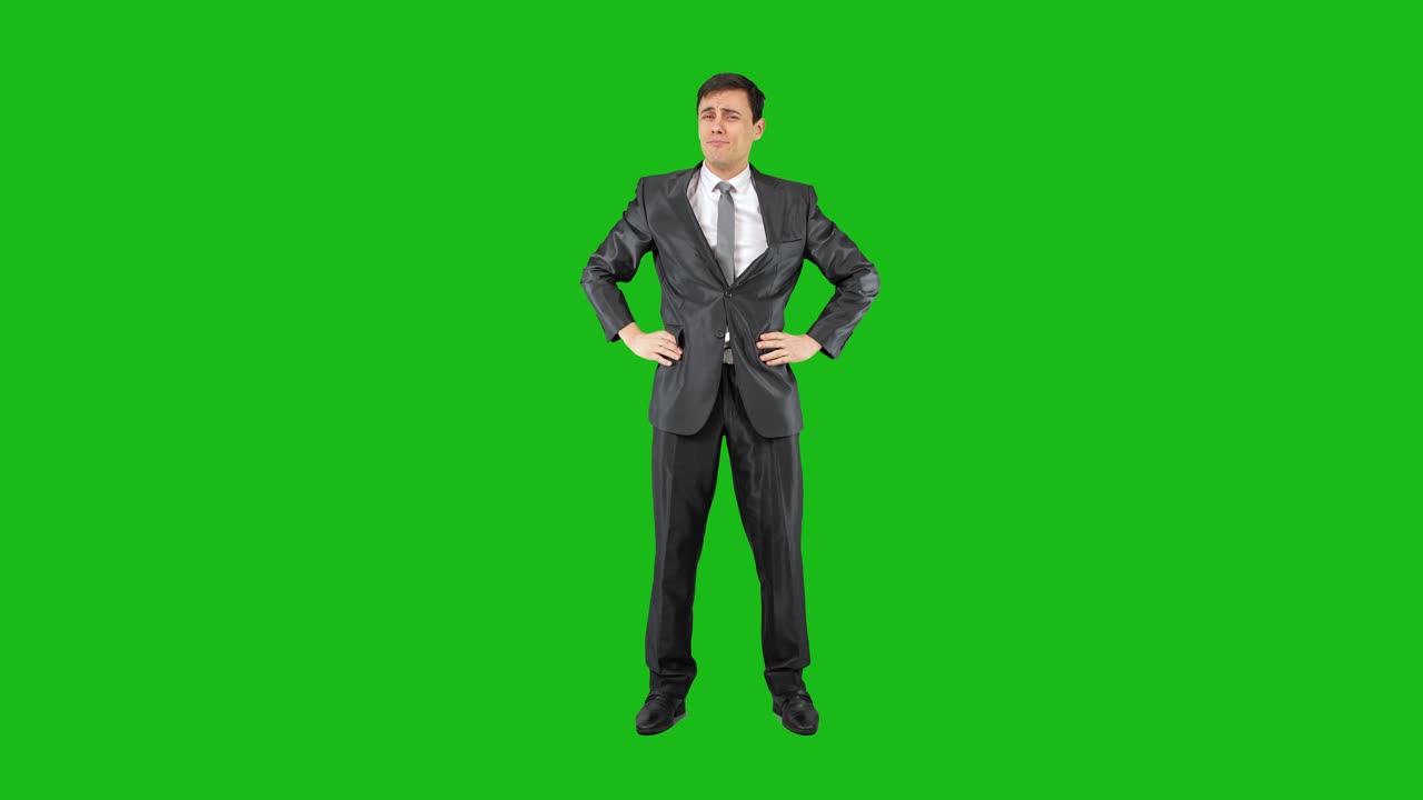 Man in Suit Performing Various Gestures and Expressions on Green Screen