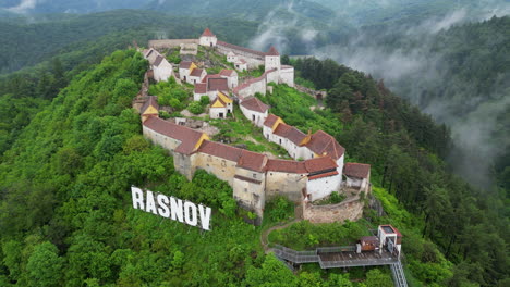 majestic rasnov citadel perched atop a verdant hill, exuding historical grandeur