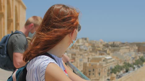 female tourists wearing sunglasses and facemask during covid-19 pandemic