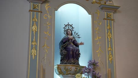 our lady of sorrows statue in ornate church setting