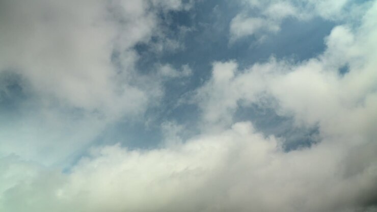 Cumulus Clouds Rolling Over And Thickening With Darkening Tones While Upper Cloud Layer Moves In Different Direction. Summer, England. Time Lapse 60X