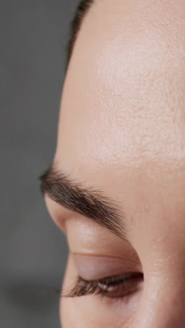close-up of a woman's forehead and eye