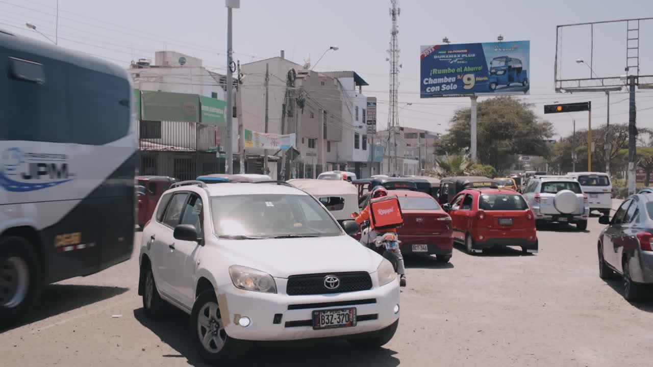 Busy Street Scene in Peru with Traffic and Autos