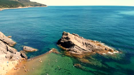 Calm-beach-with-rock-formations-and-crystal-clear