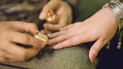 the bride's stunning nails are given a second layer of glitter by the stylist