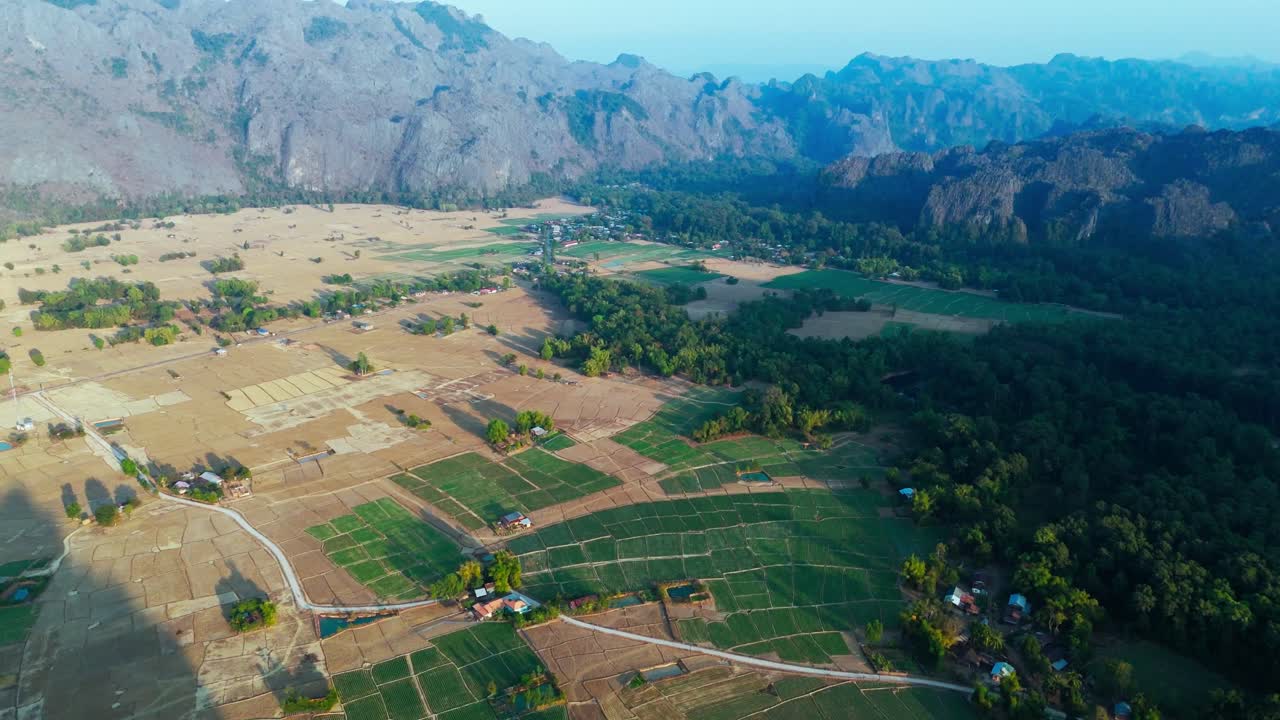 Thakhek Loop, agricultural fields in Laos, Aerial landscape view, plantation parcels in Mountain Valley