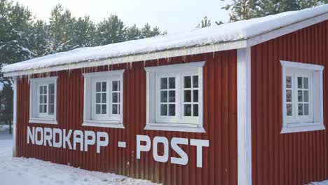 Typical-red-wooden-house-in-Nordkapp,-Norway