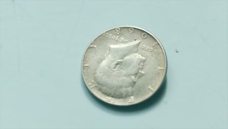coin of 50 cents value stopping to spin