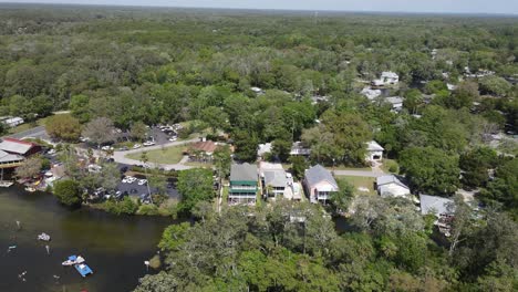 spinning-aerial-showcasing-a-busy-weekend-of-family-and-friends-at-Roger's-Park,-Weeki-Wachee,-Florida