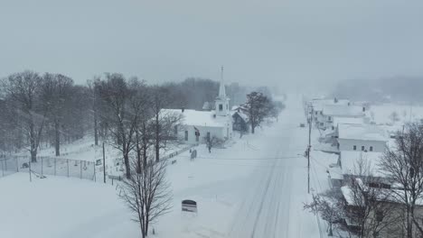 monson community church in heavy snowfall realtime aerial