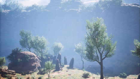 landscape with rocky formations and lush trees in a misty setting at midday
