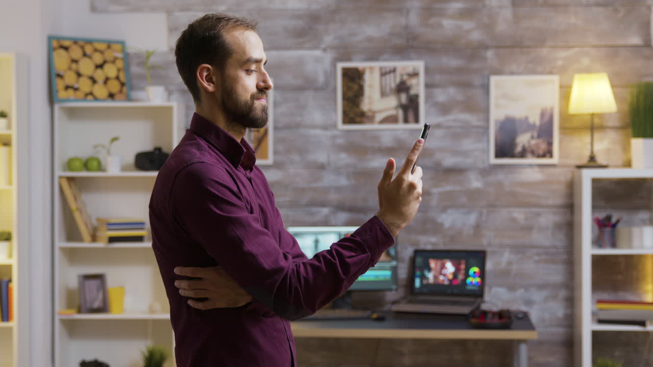 Man Using Phone in Office