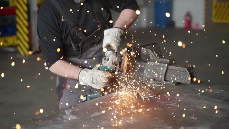 a man working with angle grinder, sparkles, super slow motion