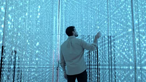an enchanting stock video of a man strolling through a surreal lightscape at teamlab planets tokyo.