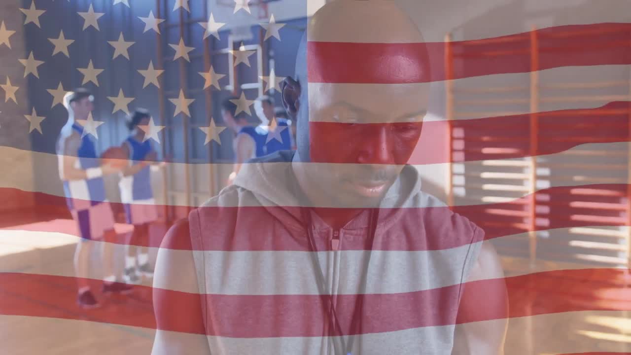 Animation of flag of united states of america over male coach and basketball team