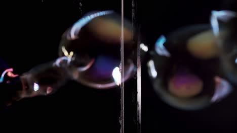 Close-up-Soap-bubbles-fly-through-the-soap-curtain-With-color-highlights