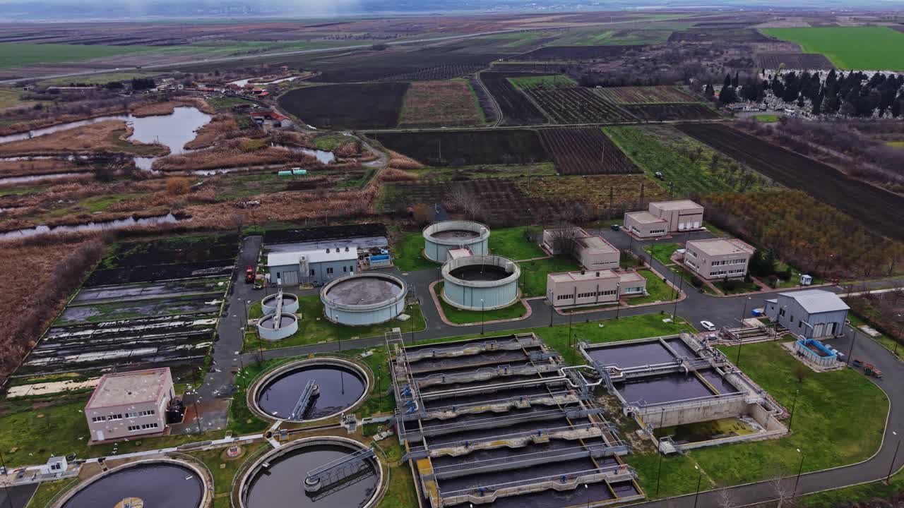 Treatment plant processes water near fields and a pond in rural area
