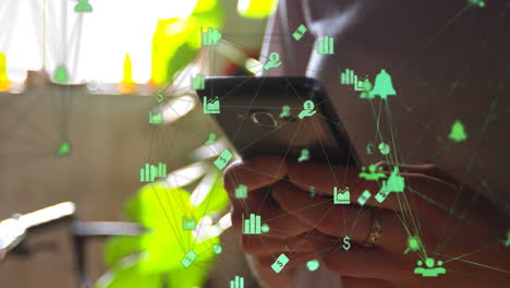 animation of network of digital icons over woman using smartphone