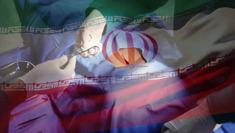 animación de la bandera de irán ondeando sobre los cirujanos en el quirófano
